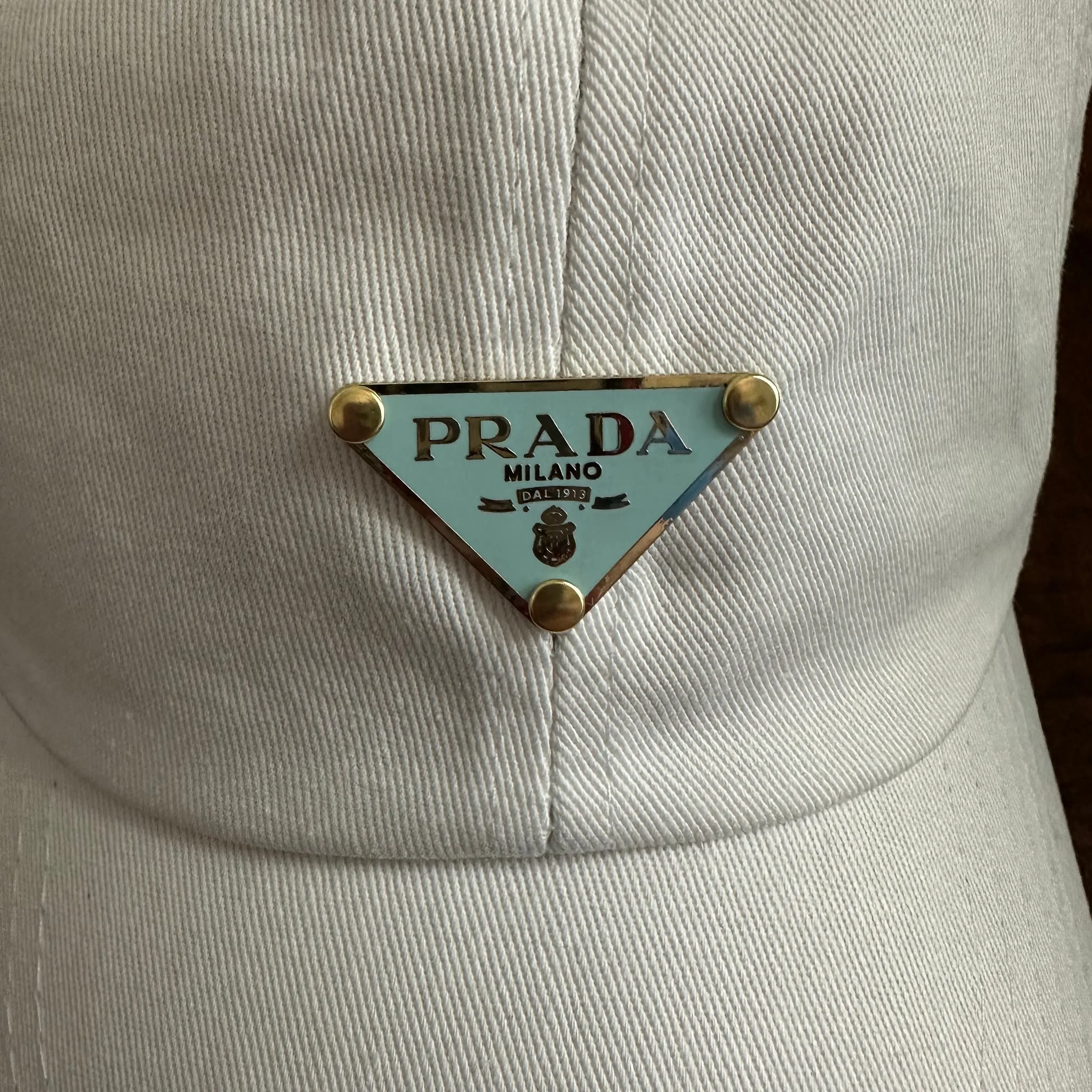 Upcycled Baby Blue/Gold Prada Tag Hat in White (undistressed)